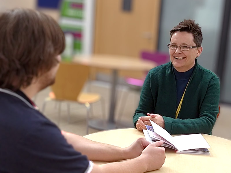 Woman talking to a student