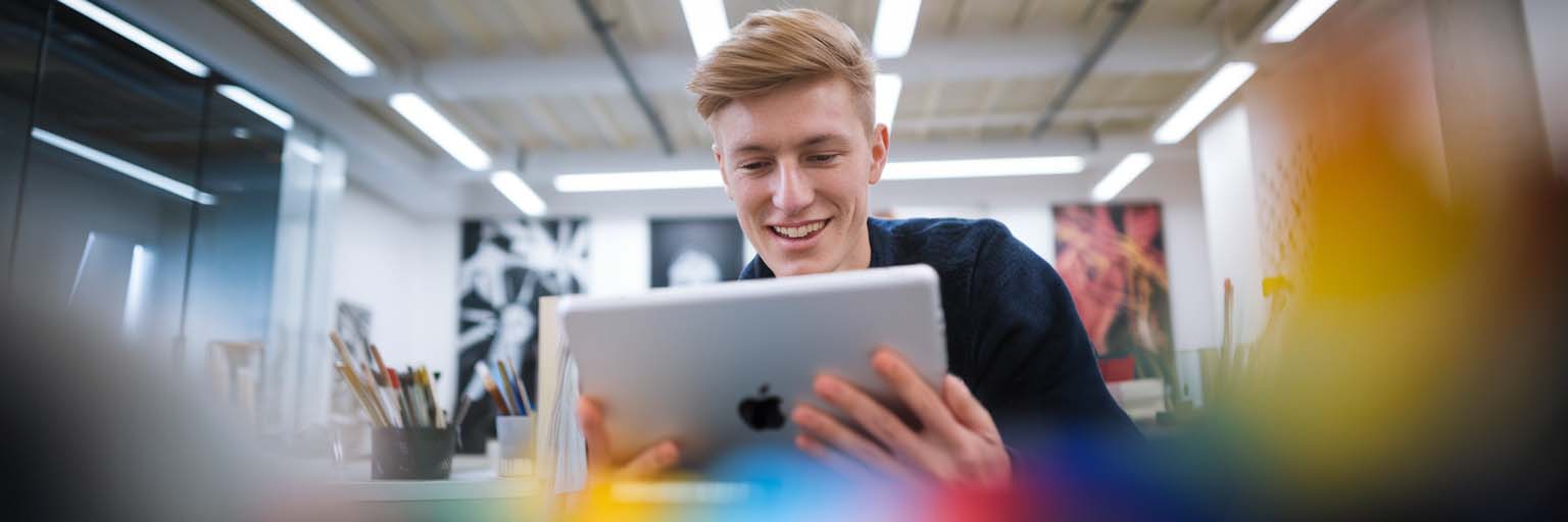 Student with iPad in studio