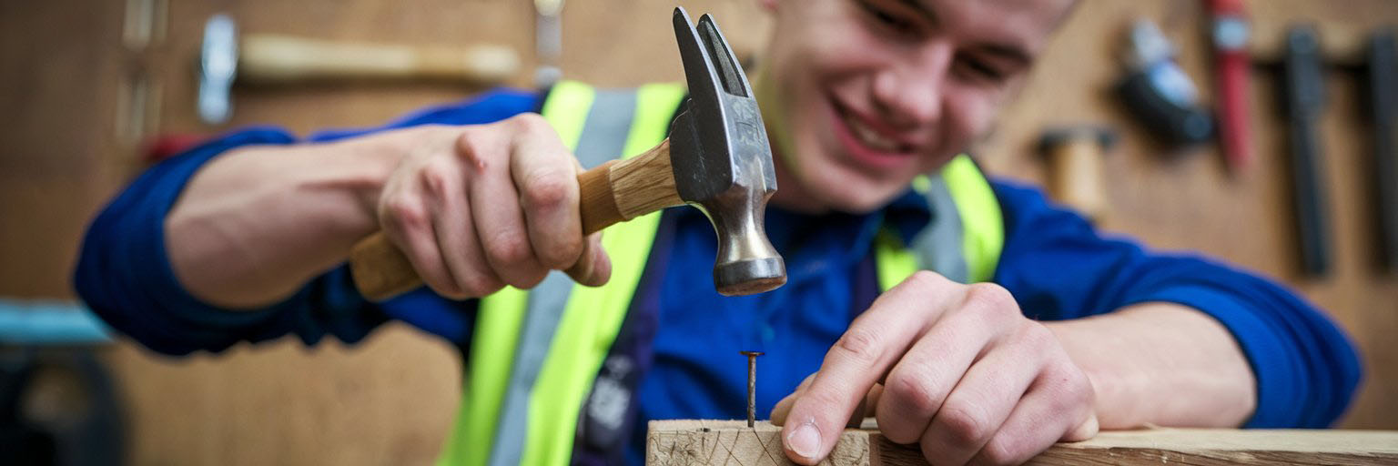 Student hammering a nail