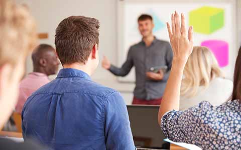 Adult student presenting in class