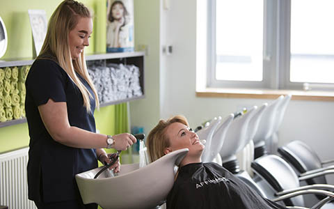 Hair and Beauty student treating a customer