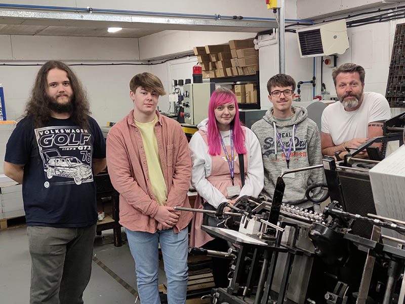 Students with industrial print press