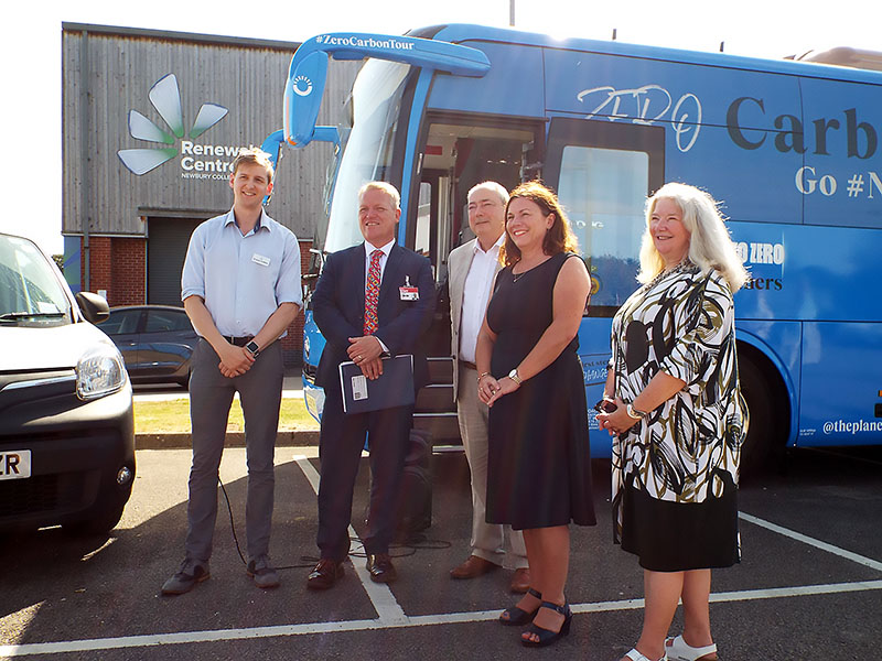 Iain Wolloff and dignitaries with electric bus