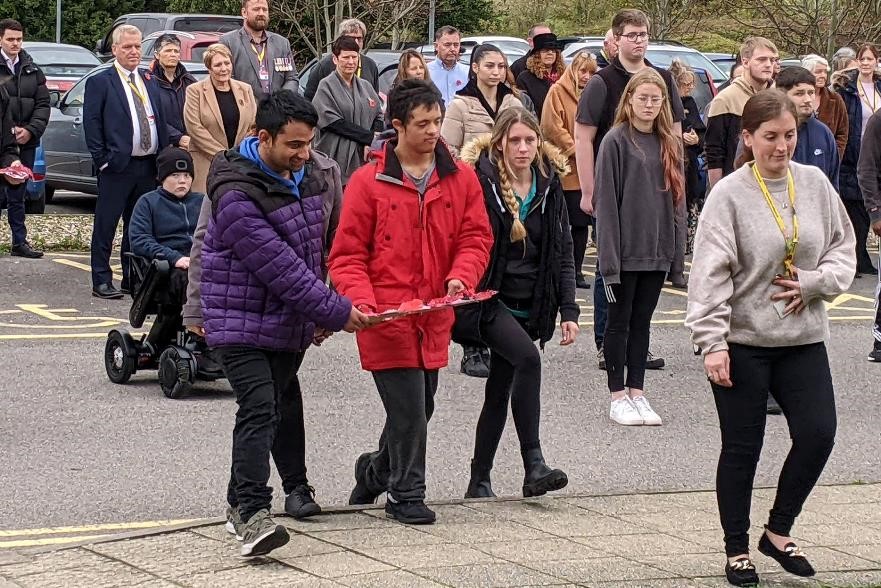 Foundation Learning students lay a wreath in the memorial garden