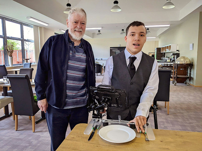 Engineer Rob Chicken and Catering student Rufus West demonstrate the table-setting template
