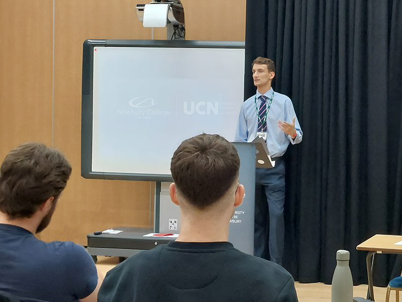 Harry Langhorn addressing students at Newbury College