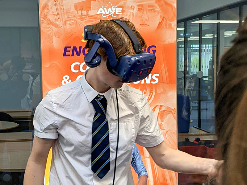 School student engaging with VR on the AWE stand