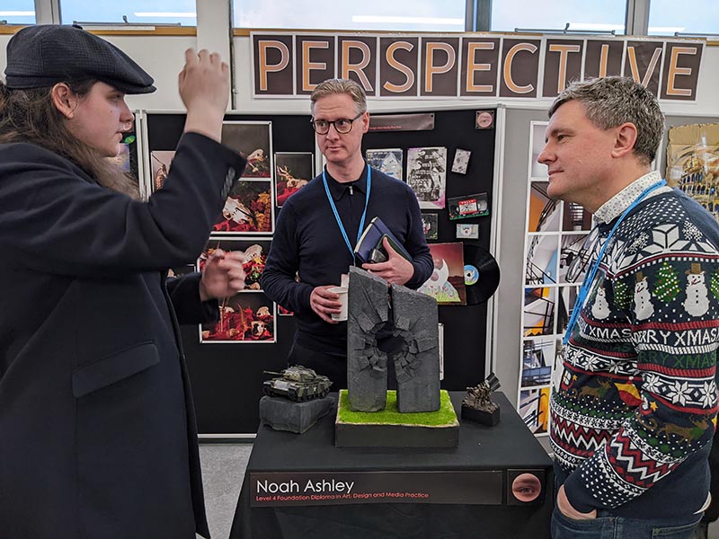 Noah Ashley presents his work to Principal Lee Probert and Deputy Principal Lee Jamieson