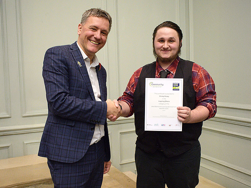 Newbury College Deputy Principal, Lee Jamieson, congratulates award-winner Vinney Hosey 